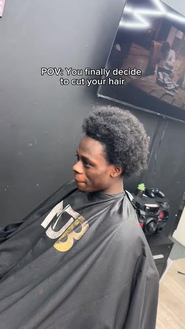 Before the big chop — consultation in the barber chair