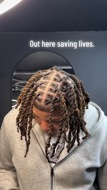 Retwisted locs styled at MJay's Barbershop